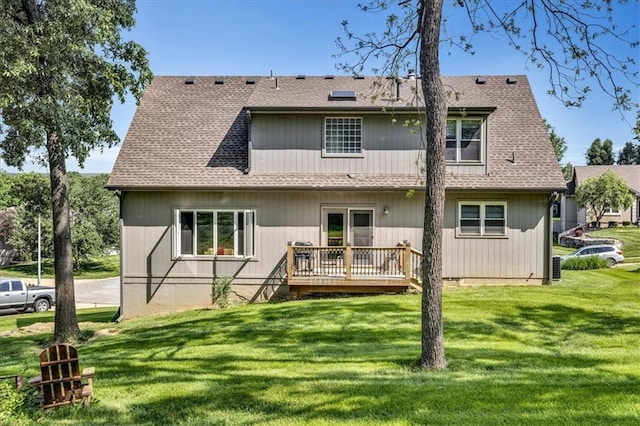 11705 E 86th Ter, Raytown, MO 64138 - back of property featuring a deck, a lawn, and a shingled roof