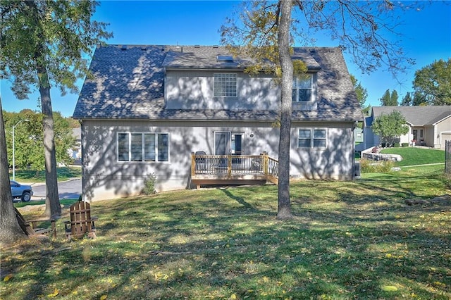 11705 E 86th Ter, Raytown, MO 64138 - back of house with a deck and a lawn