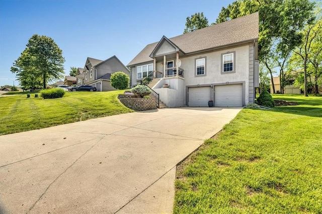 11705 E 86th Ter, Raytown, MO 64138 - view of front facade featuring driveway, an attached garage, a front yard, and stucco siding