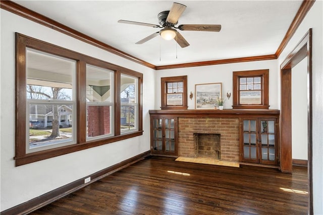 unfurnished living room featuring crown molding, plenty of natural light, and wood finished floors