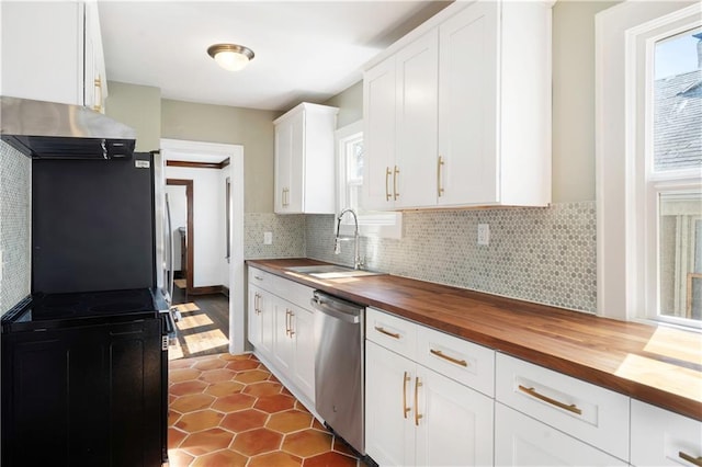 kitchen with a sink, wood counters, stainless steel dishwasher, range hood, and decorative backsplash