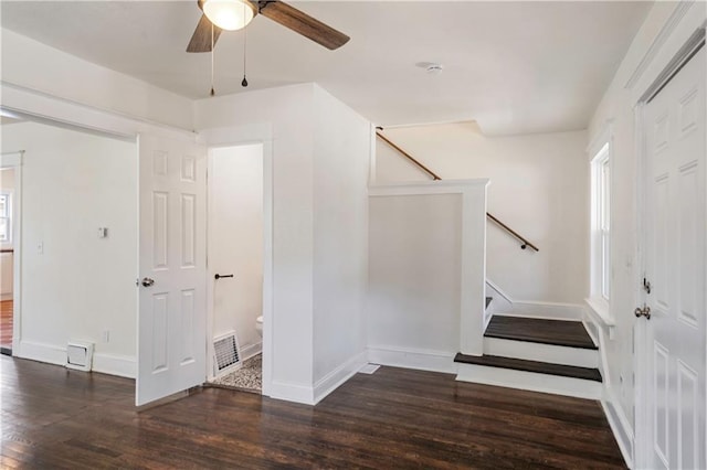 entrance foyer featuring visible vents, baseboards, ceiling fan, and wood finished floors