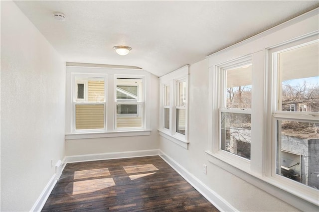 unfurnished sunroom with lofted ceiling