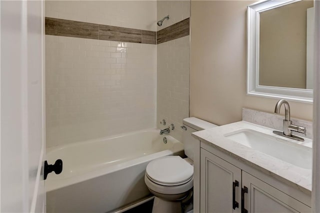 bathroom featuring shower / bathing tub combination, toilet, and vanity