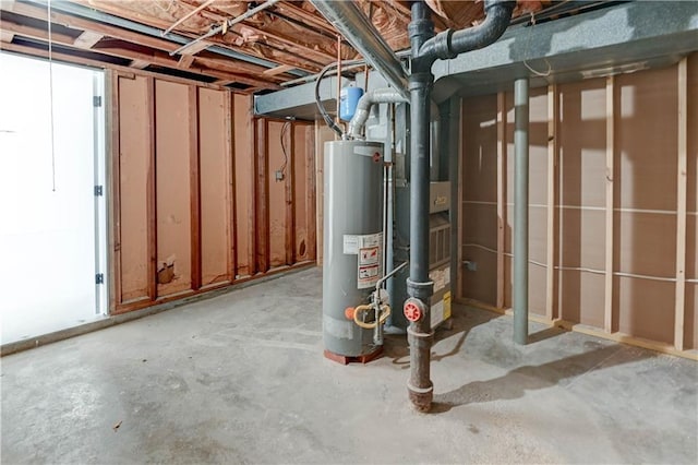 unfinished basement featuring water heater