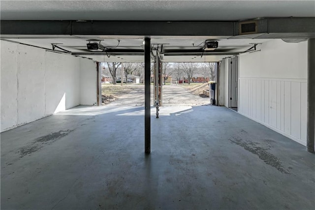 garage featuring a garage door opener