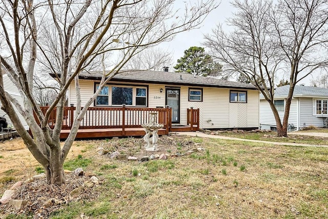 single story home featuring a wooden deck