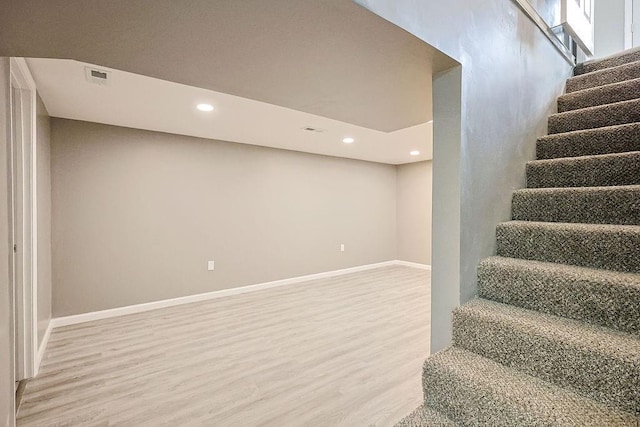 stairs featuring visible vents, recessed lighting, baseboards, and wood finished floors