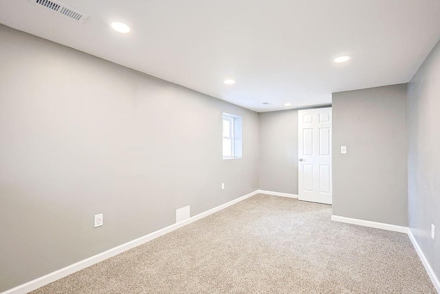 unfurnished room featuring visible vents, recessed lighting, baseboards, and carpet floors