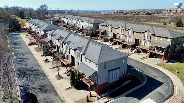 birds eye view of property with a residential view