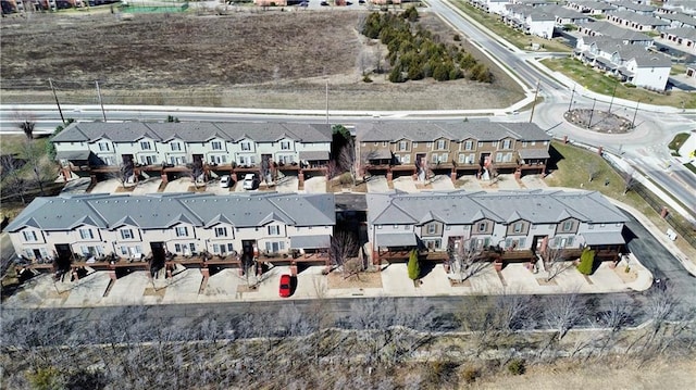 birds eye view of property with a residential view