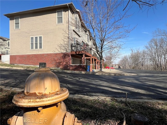 view of home's exterior with brick siding