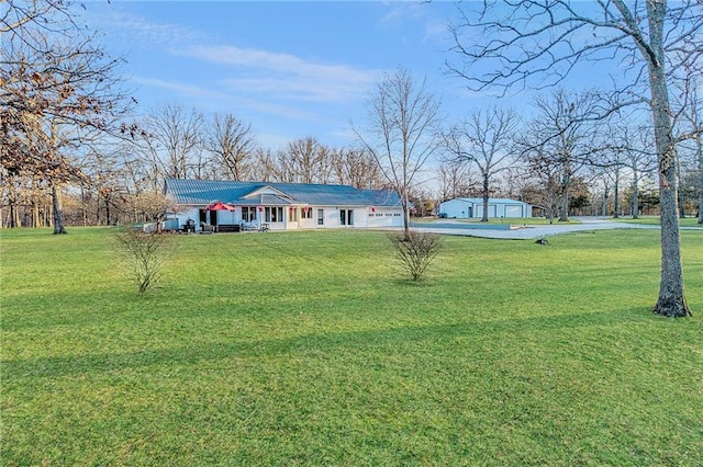 view of front of property with an attached garage and a front lawn