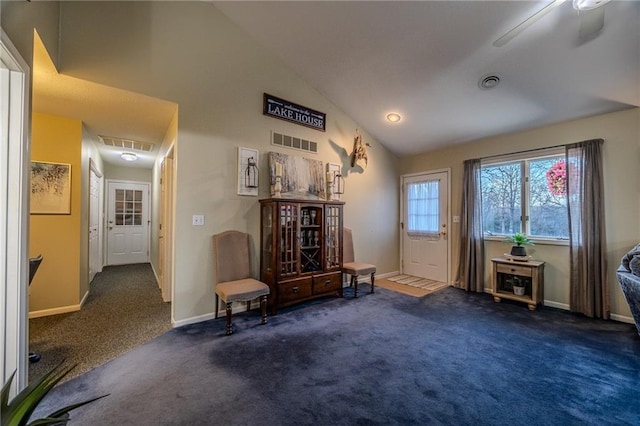 entryway with visible vents, carpet floors, and baseboards