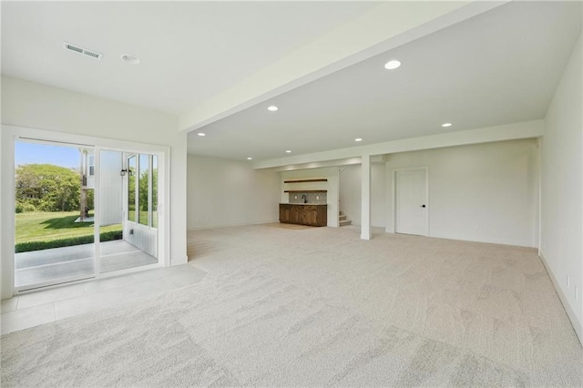 1518 NW 106th Ter, Kansas City, MO 64155 - unfurnished living room featuring carpet, recessed lighting, and stairway