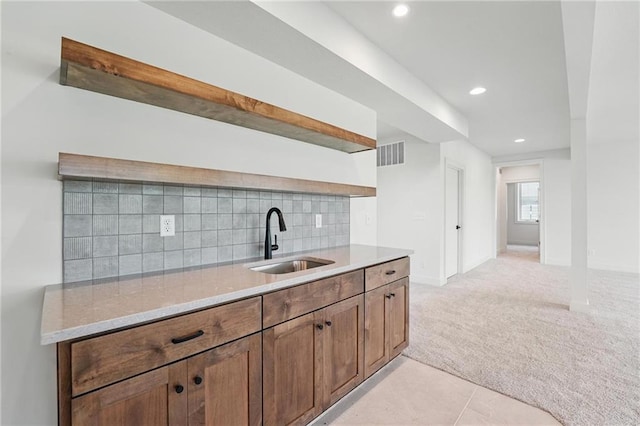 1518 NW 106th Ter, Kansas City, MO 64155 - kitchen featuring open shelves, light carpet, backsplash, recessed lighting, and light stone countertops