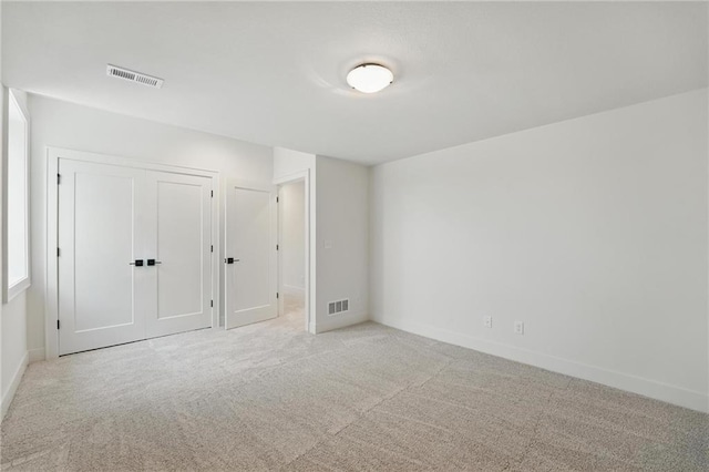 1518 NW 106th Ter, Kansas City, MO 64155 - unfurnished bedroom featuring light colored carpet and a closet