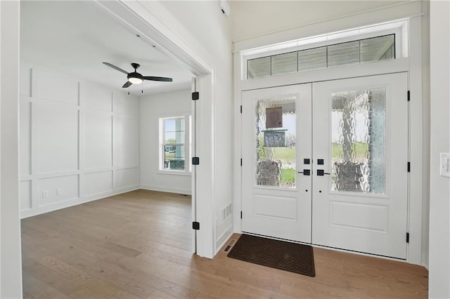 1518 NW 106th Ter, Kansas City, MO 64155 - foyer with french doors, wood finished floors, and ceiling fan
