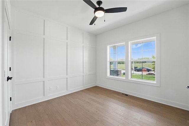 1518 NW 106th Ter, Kansas City, MO 64155 - empty room with light wood-style floors and ceiling fan