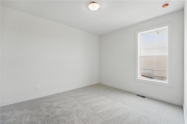 1518 NW 106th Ter, Kansas City, MO 64155 - carpeted empty room featuring baseboards