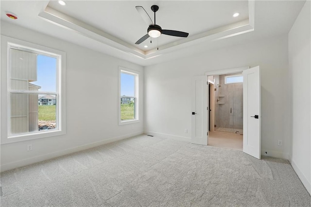 1518 NW 106th Ter, Kansas City, MO 64155 - spare room with plenty of natural light, carpet flooring, a raised ceiling, a ceiling fan, and recessed lighting