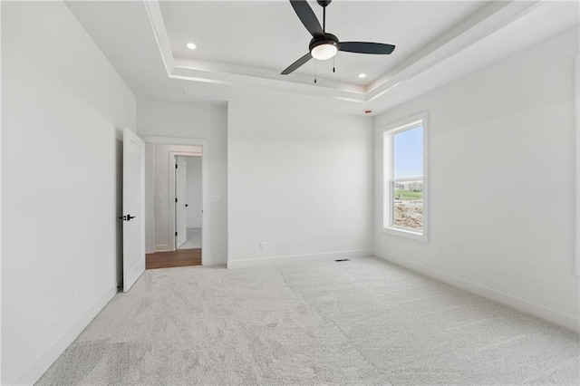 1518 NW 106th Ter, Kansas City, MO 64155 - empty room featuring a raised ceiling, carpet flooring, ceiling fan, and recessed lighting