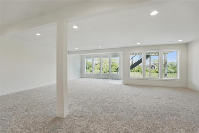 1518 NW 106th Ter, Kansas City, MO 64155 - unfurnished living room with carpet flooring and recessed lighting