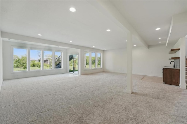1518 NW 106th Ter, Kansas City, MO 64155 - unfurnished living room featuring light carpet and recessed lighting