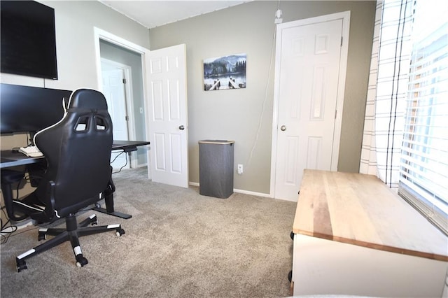 office with baseboards and carpet floors