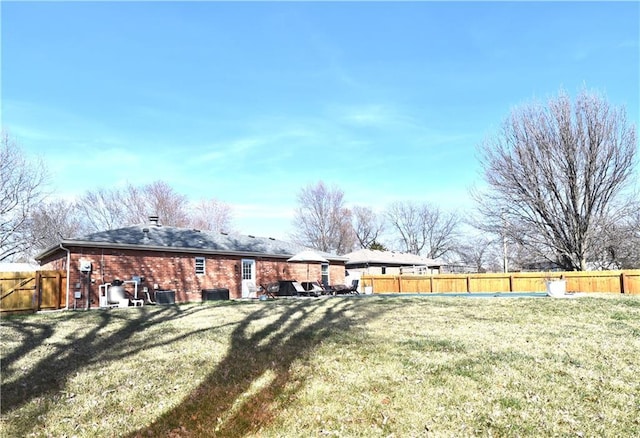 view of yard featuring cooling unit and a fenced backyard