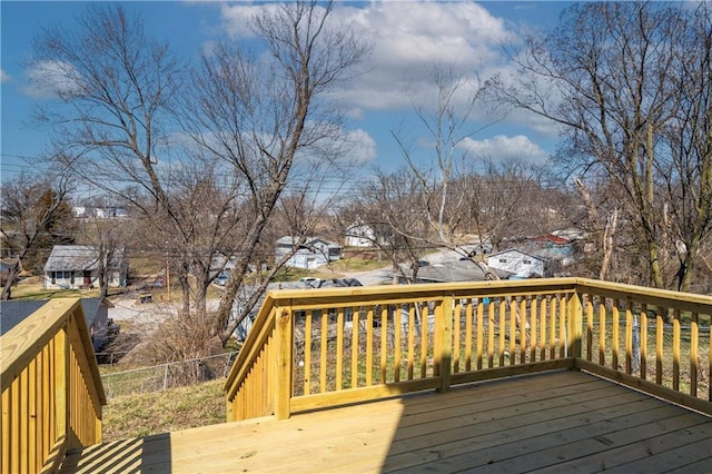 wooden terrace featuring fence