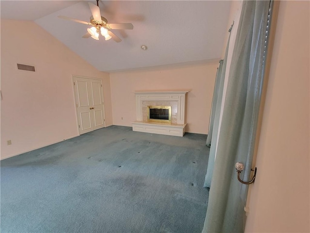 unfurnished living room with ceiling fan, carpet, lofted ceiling, and a premium fireplace