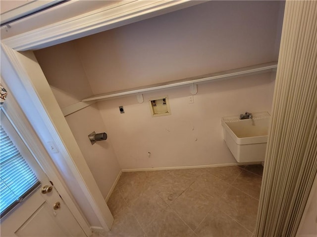 clothes washing area with baseboards, hookup for a washing machine, light tile patterned flooring, hookup for an electric dryer, and a sink