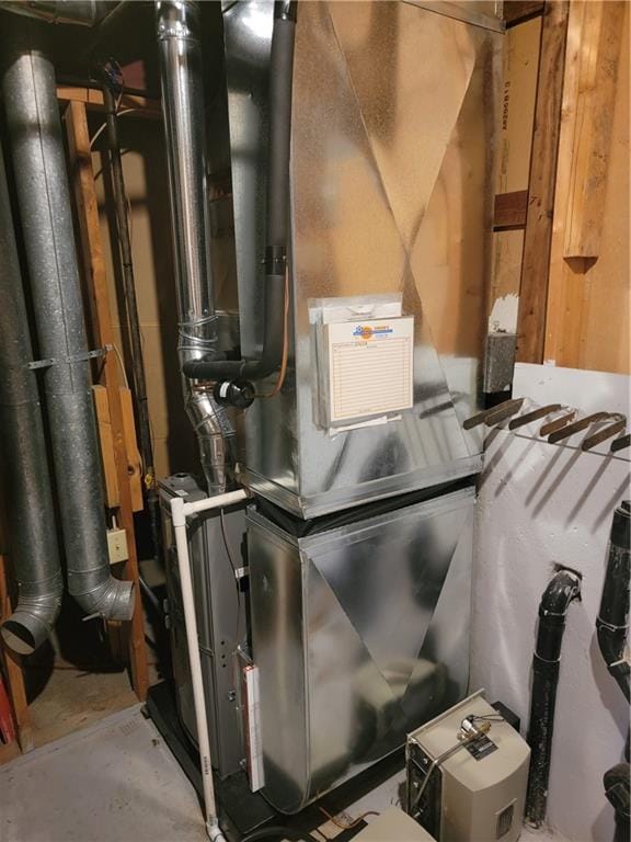 utility room with heating unit