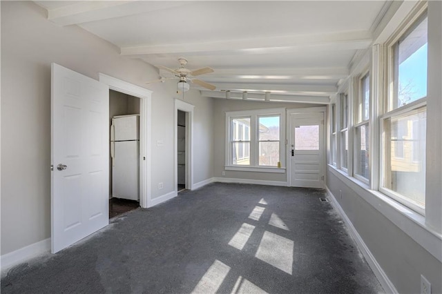 interior space featuring beam ceiling and ceiling fan