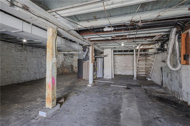 unfinished basement featuring water heater