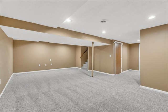 finished basement with recessed lighting, visible vents, baseboards, and carpet flooring