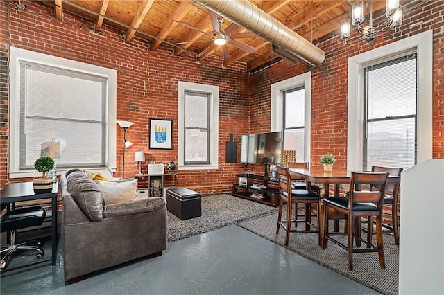 living room with a ceiling fan, brick wall, wood ceiling, concrete flooring, and beamed ceiling