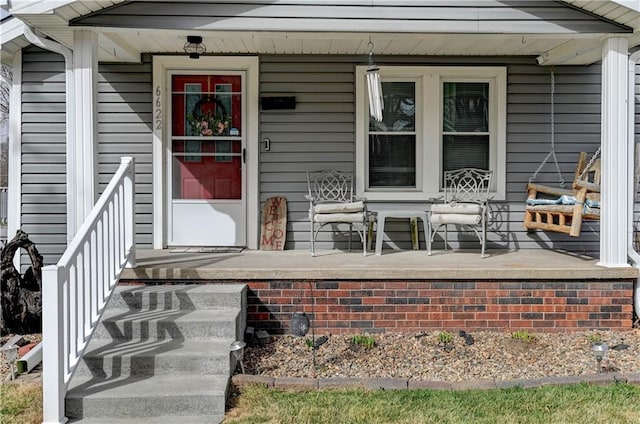 property entrance featuring a porch