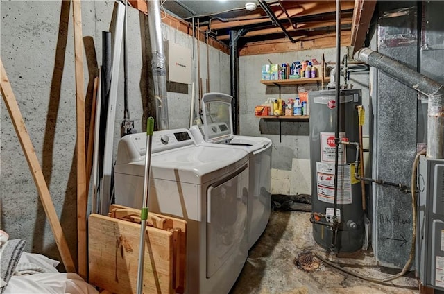 laundry area with laundry area, gas water heater, and washer and clothes dryer