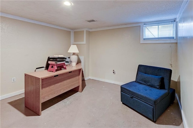 sitting room with visible vents, baseboards, a textured ceiling, and concrete flooring