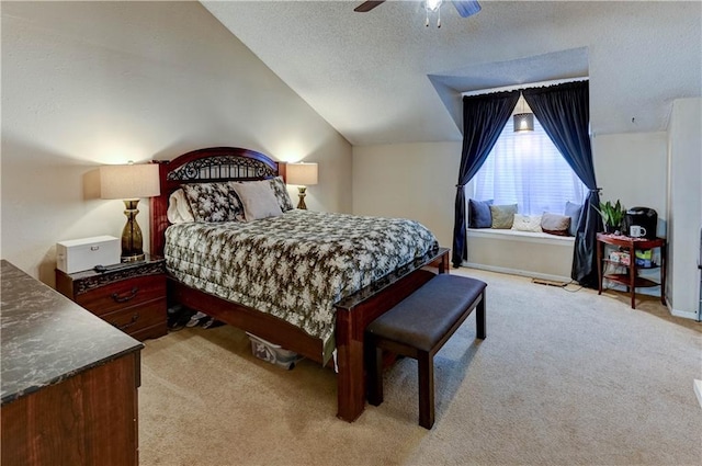 bedroom with baseboards, light colored carpet, vaulted ceiling, a textured ceiling, and a ceiling fan