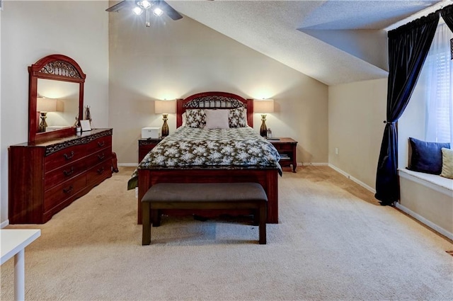 bedroom with ceiling fan, baseboards, light colored carpet, vaulted ceiling, and a textured ceiling