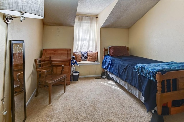 bedroom featuring carpet flooring, a textured ceiling, baseboards, and a textured wall