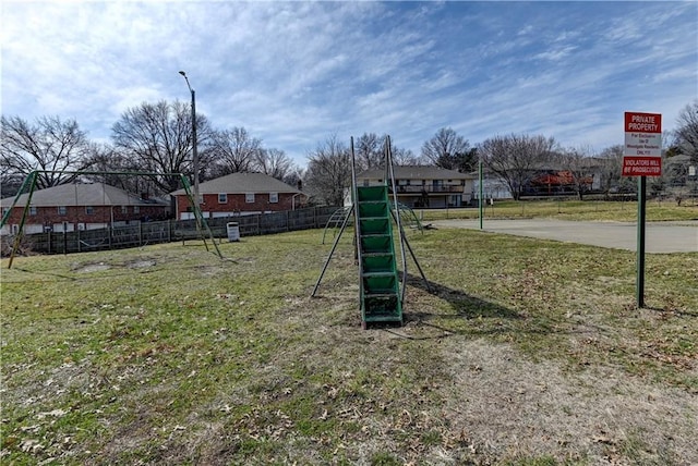 view of yard with a residential view and fence