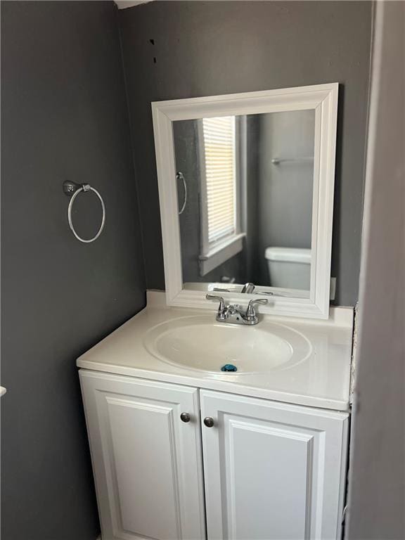 bathroom with toilet and vanity