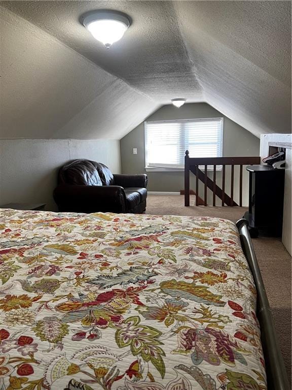 bedroom featuring light carpet, a textured ceiling, and vaulted ceiling