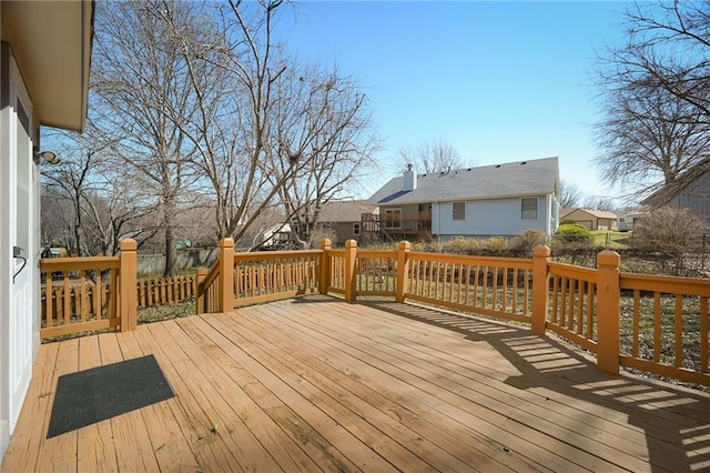 wooden terrace with a residential view