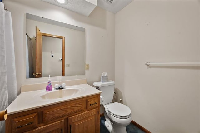 bathroom with toilet and vanity