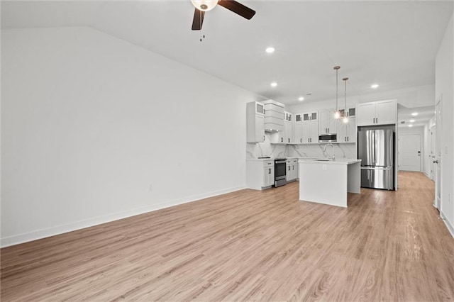 unfurnished living room with a ceiling fan, baseboards, light wood finished floors, recessed lighting, and a sink